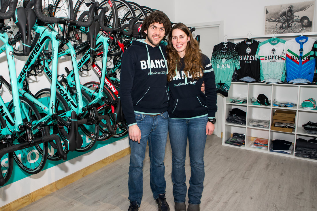 Couple in Bianchi Apparel with Bikes