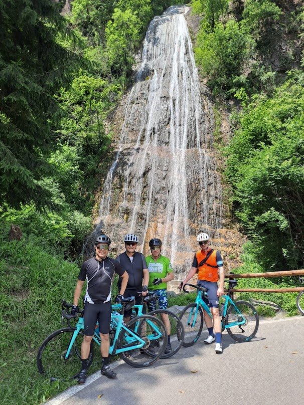 Cyclists by Waterfall - view of lake como - Bike It! Bellagio