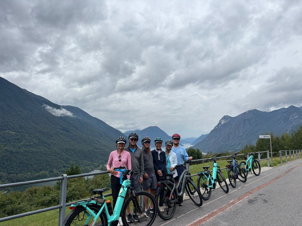 Cyclists with Bikes in Mountain Landscape